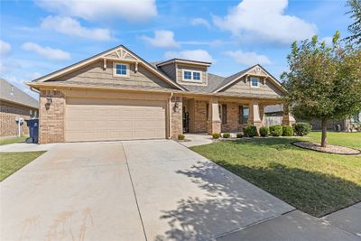 Craftsman house with a porch and a front yard | Image 1