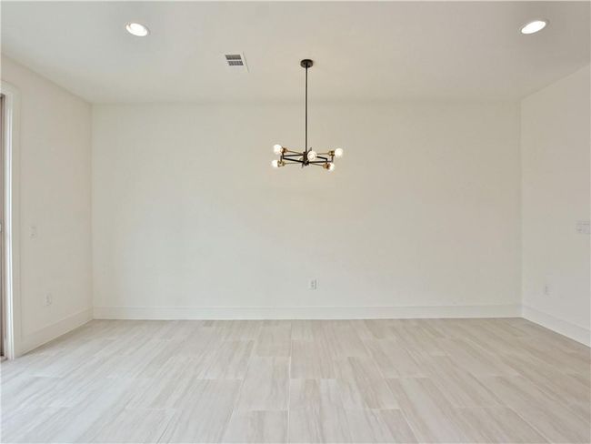 Empty room featuring a chandelier, recessed lighting, and light wood finished floors | Image 7