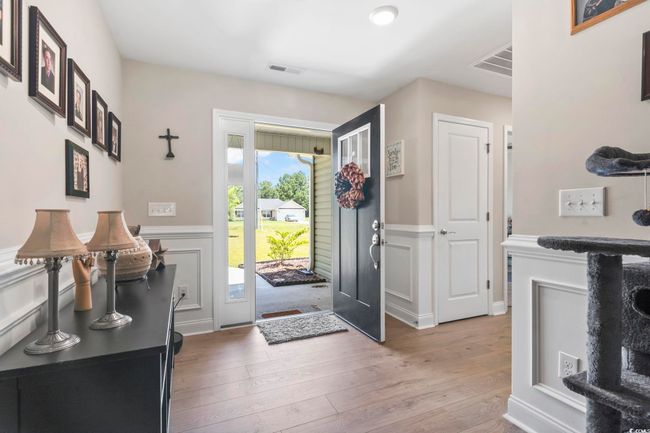 Foyer with light wood-style floors and wainscoting | Image 4