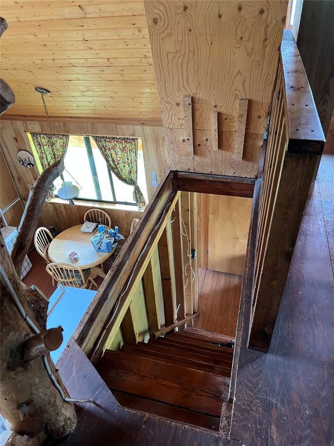 steps to the loft - hinged wood comes down to make a solid floor as needed | Image 45