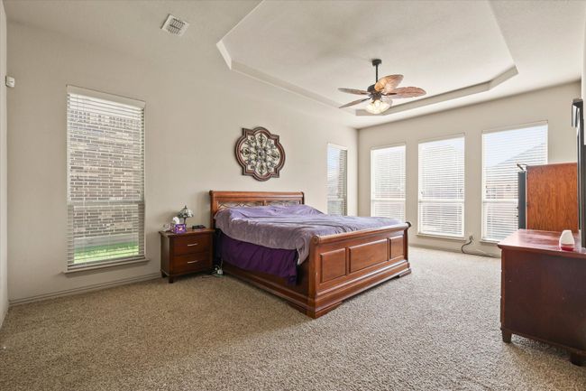 Tray ceilings and large windows adding a luxurious feel | Image 15