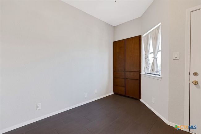 Bedroom with built in storage. | Image 13