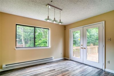 Dining area leading out to deck | Image 3