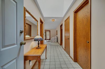 Large welcoming entry with tile floor, large closet and laundry / garage access to the left | Image 2