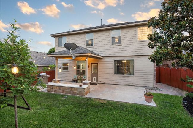 Rear view of property featuring a patio and a fenced backyard | Image 24