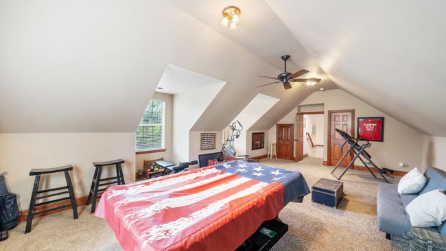 Bedroom with carpet flooring, baseboards, and vaulted ceiling | Image 32