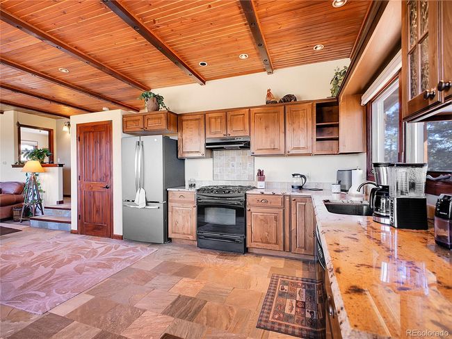 Open Floor Plan, High Wood Plank Ceiling, Quaritize Tile Floor | Image 6