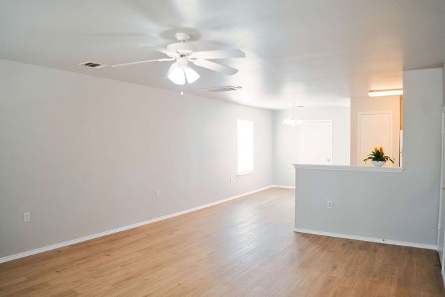 Unfurnished room with ceiling fan and light wood-type flooring | Image 9