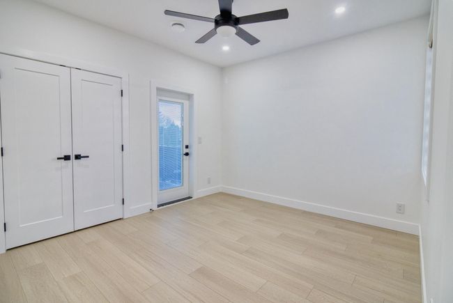 Unfurnished bedroom featuring light wood-type flooring, baseboards, recessed lighting, access to exterior, and a ceiling fan | Image 16