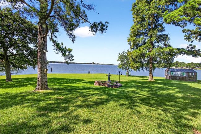 View of grassy yard with a water view | Image 11