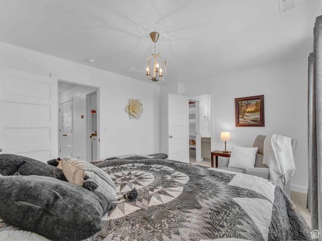 Bedroom 2 featuring a chandelier and light colored carpet | Image 32