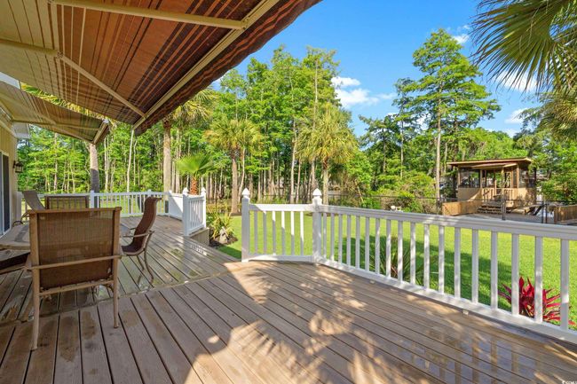 Deck with view of scattered trees | Image 35