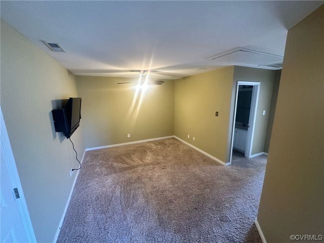 Unfurnished room with carpet floors and ceiling fan | Image 14