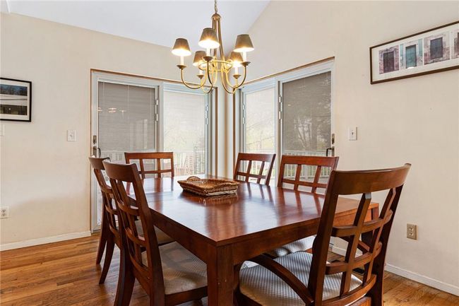 Dining room with louver sliders for privacy | Image 18