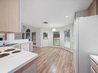 THE BREAKFAST NOOK LOOKS OUT TO THE BEAUTIFUL BACK YARD AND HAS ACCESS TO THE COVERED BACK PORCH. | Image 3