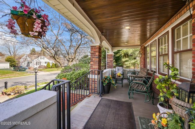 Rocking chair from porch with Mahogany wood floor and bed board teak ceilings. | Image 5