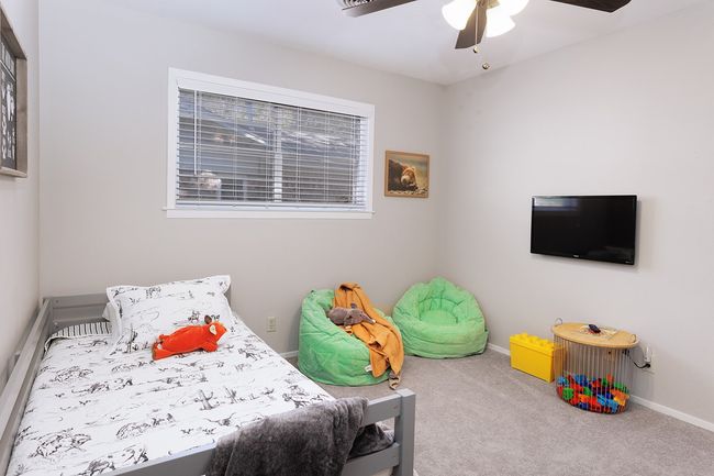 Bedroom with ceiling fan, baseboards, and carpet flooring | Image 25