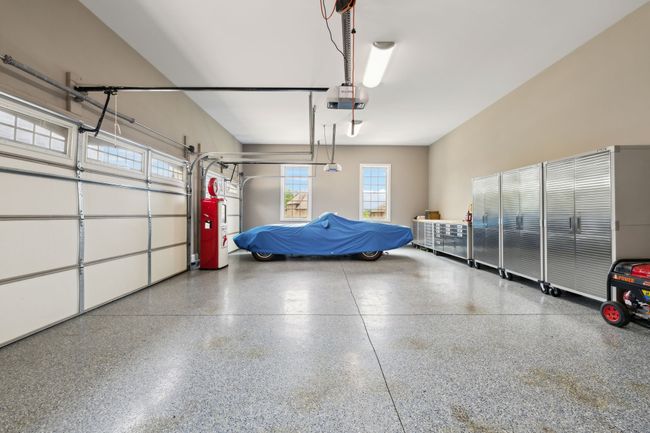 Space, function, and beauty in a GARAGE?? Yep, this garage has it all... Great lighting, Large Work Sink, Painted Floors, and ... | Image 63