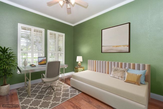 Office virtually staged with trundle bed for guest overflow. | Image 7