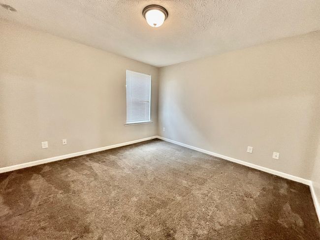 The guest bedrooms are large | Image 13