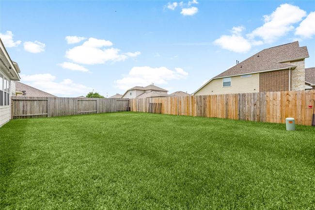Unwind outdoors in this fully fenced backyard offering privacy and space for the whole family to enjoy. | Image 20