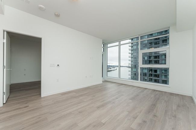 Empty room with light wood-style floors and baseboards | Image 14
