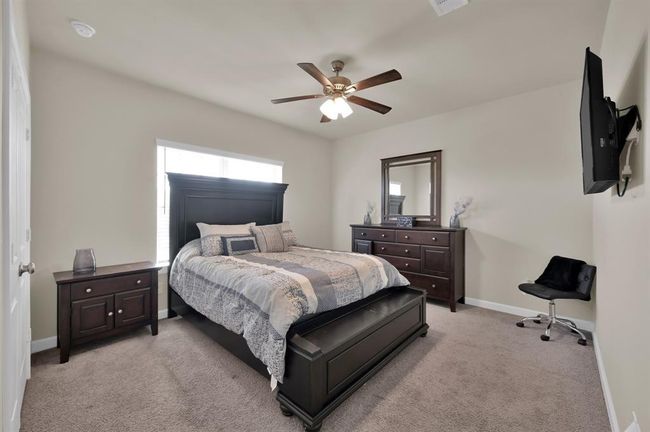 Bedroom 2 faces the front of the home. | Image 21
