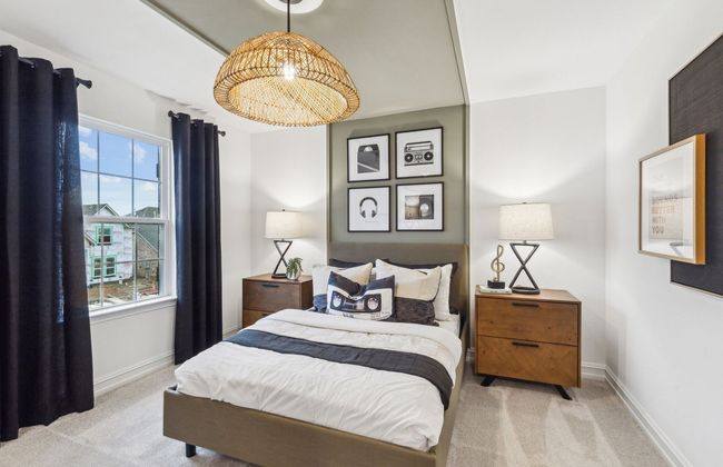 Spacious secondary bedroom with large windows *Photos of furnished model. Not actual home. Representative of floor plan. Some options and features may vary | Image 15