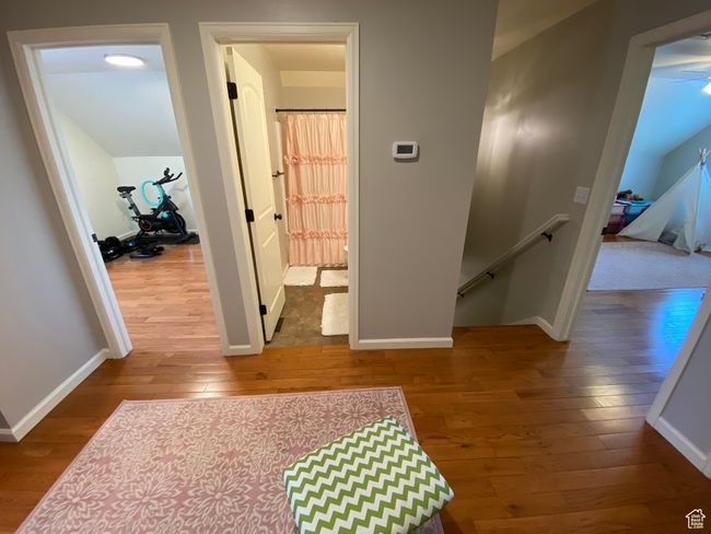 Corridor featuring an upstairs landing, hardwood / wood-style flooring, and baseboards | Image 22