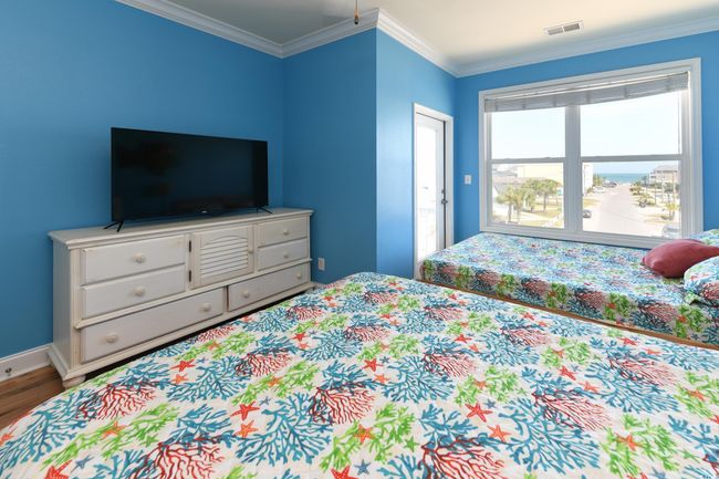 Bedroom featuring ornamental molding, visible vents, baseboards, and wood finished floors | Image 19