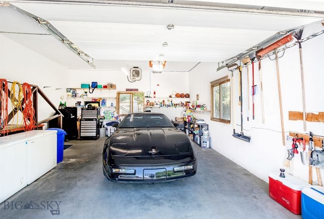 garage with automatic garage door opener | Image 34