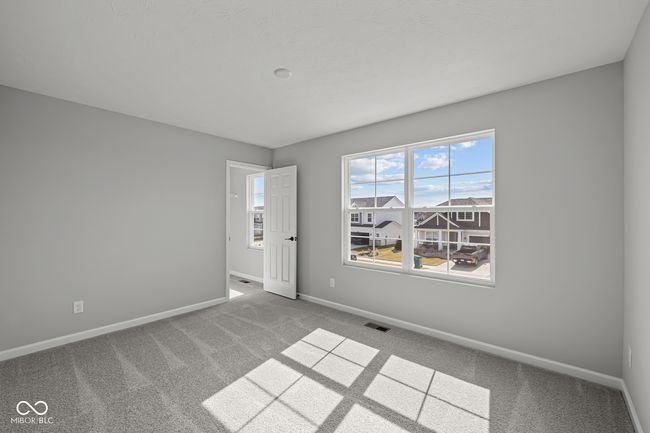 carpeted spare room with baseboards and visible vents | Image 13