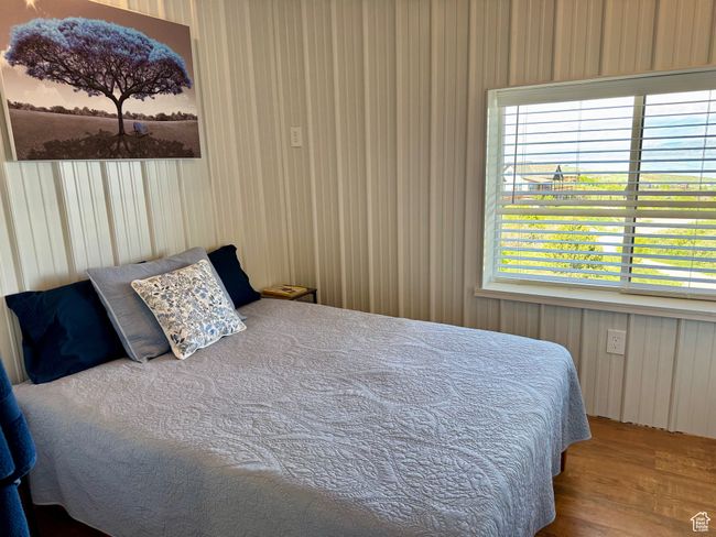 Guest Bedroom featuring wood-type floors, and new bedroom furniture | Image 16