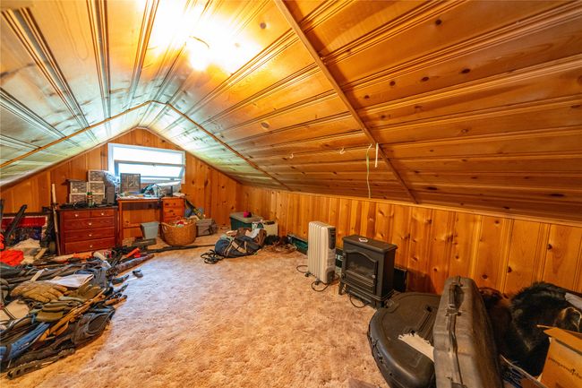 Bonus room with wooden walls, vaulted ceiling, wood ceiling, and carpet floors | Image 47
