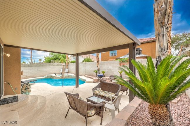 View of pool featuring a patio area and a fenced backyard | Image 31