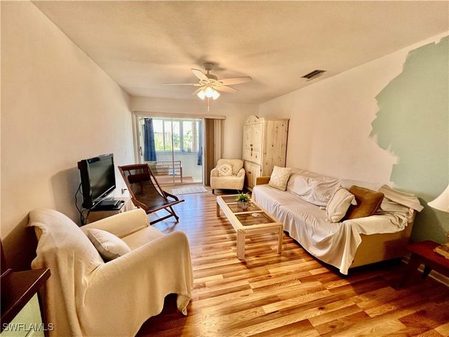 Living room with wood finished floors. | Image 7