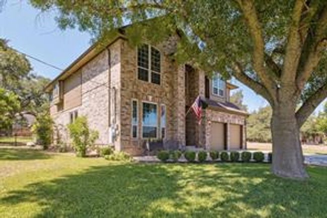 View of front of house featuring a garage and a front yard | Image 6