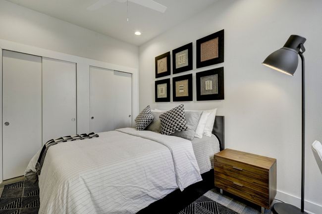 Bedroom with two closets, ceiling fan, and recessed lighting | Image 18