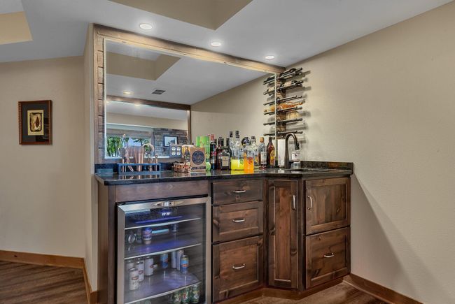 Enjoy the spacious lower level complete with a built-in wet bar, ideal for hosting or creating your own home retreat. | Image 25