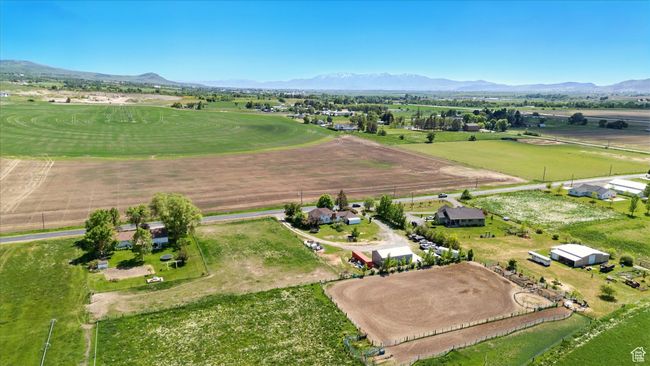 Aerial view of property and surrounding area featuring a mountain backdrop and rural landscape | Image 34