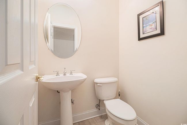 Bathroom with baseboards, toilet, and tile patterned flooring | Image 21