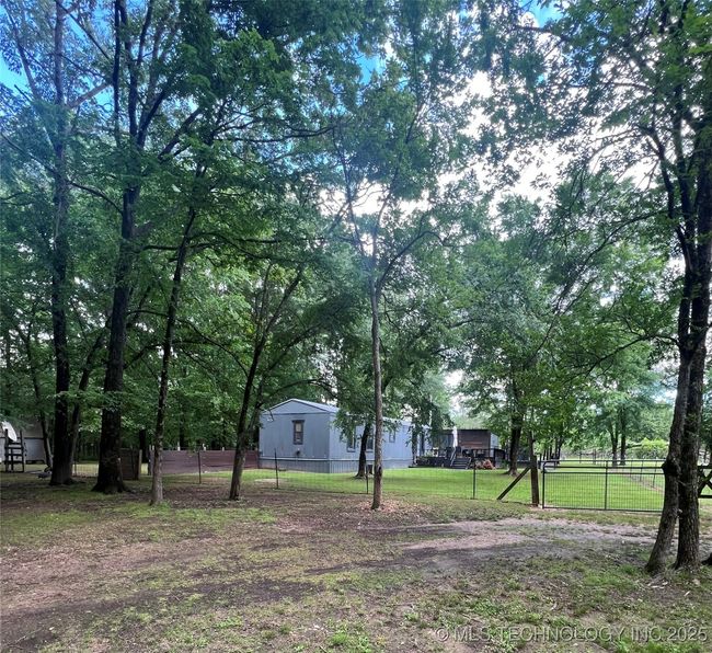 View of yard featuring fence | Image 42