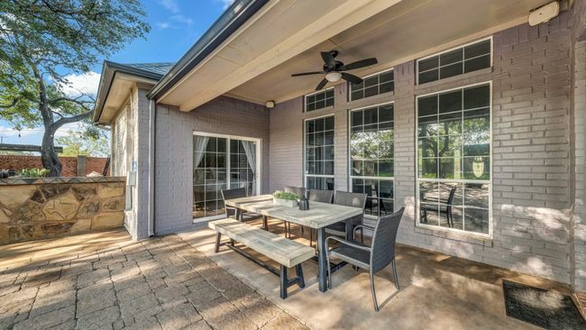 View of patio / terrace with a ceiling fan and outdoor dining space | Image 29