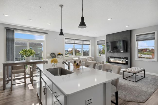 (Photo of decorated model, actual home's finishes will vary) The center island extends out to provide space for bar-style seating. | Image 7