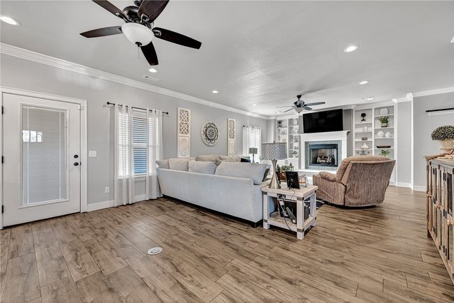 Extra space between the bar and living area. Electrical outliets in the floor. | Image 12