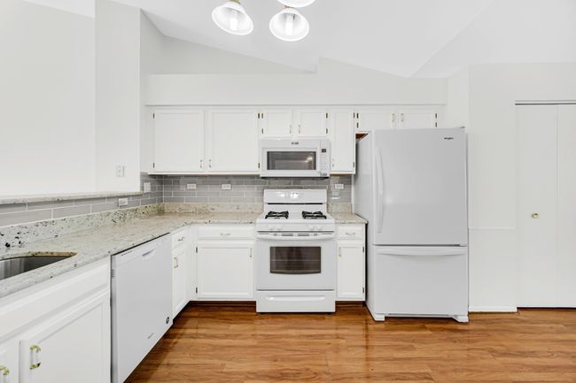 The kitchen area has ample room for a table next t | Image 8