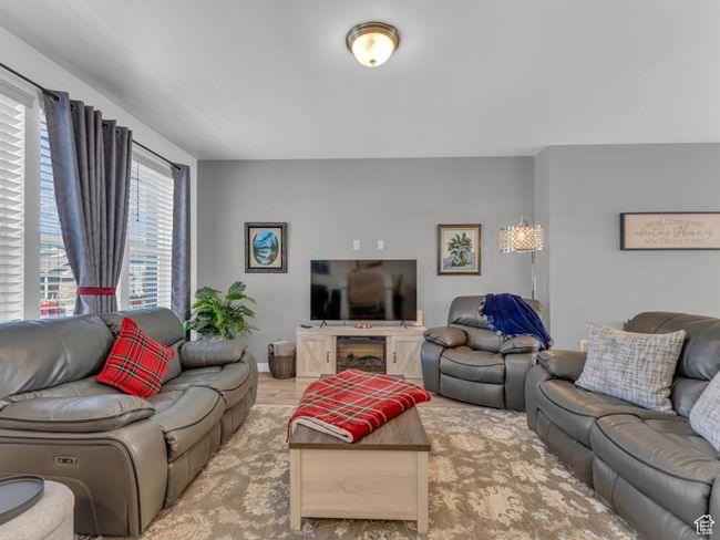 Living area featuring light wood finished floors | Image 7