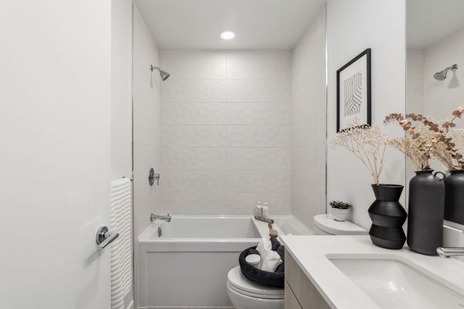 Bathroom with shower / bathing tub combination, toilet, vanity, and recessed lighting | Image 13