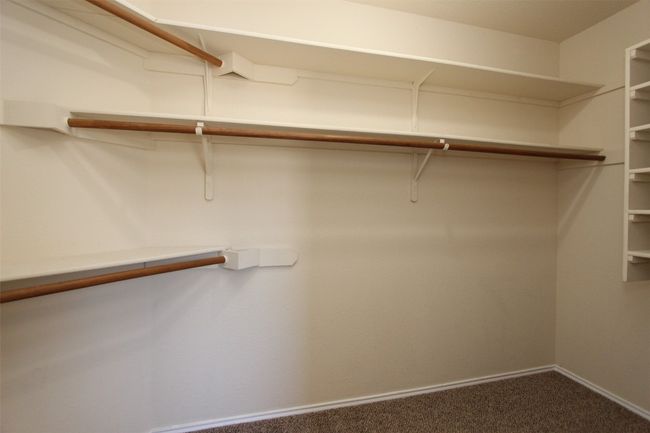 Spacious closet featuring carpet flooring | Image 15