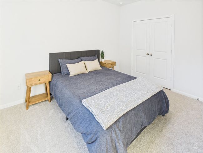 Bedroom featuring light carpet, baseboards, and a closet | Image 27